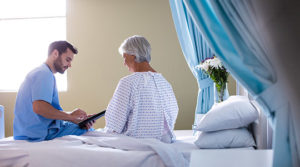 male-doctor-showing-medical-report-female-senior-patient-digital-tablet