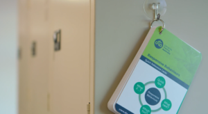 Responsive Behaviours quick reference cards hanging on hook