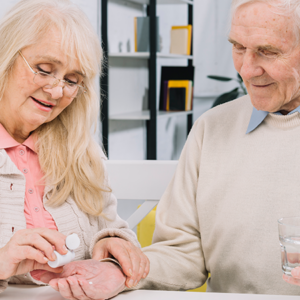 Medication-and-restraint-older-couple-with-pills