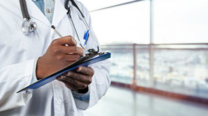 Dementia in general practice doctor filling out paperwork